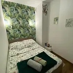 Em *